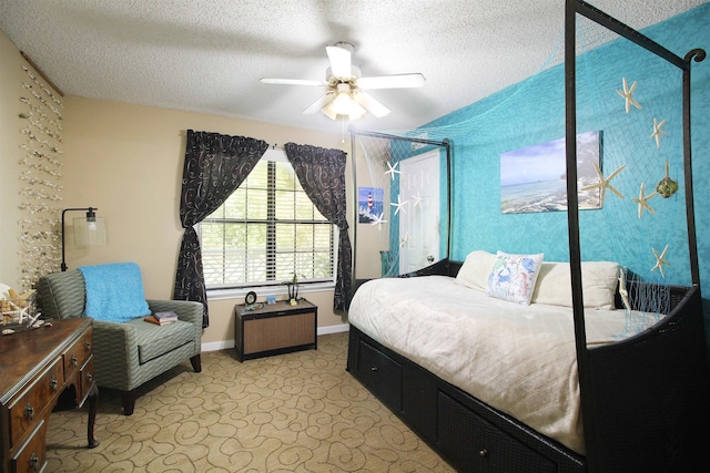 bedroom featuring a textured ceiling and ceiling fan