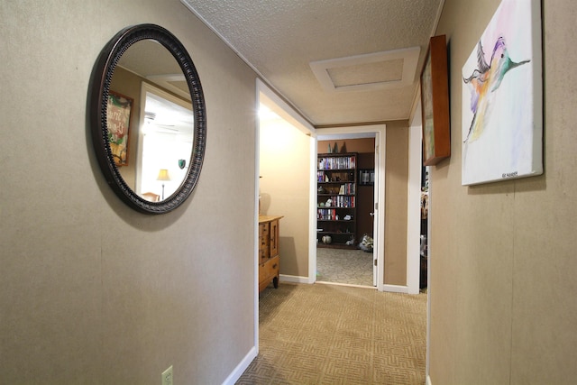 corridor featuring a textured ceiling