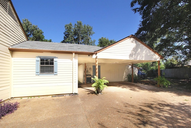 view of front of home featuring a carport