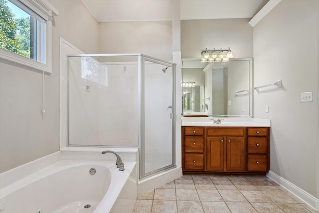 bathroom featuring tile patterned floors, vanity, and shower with separate bathtub