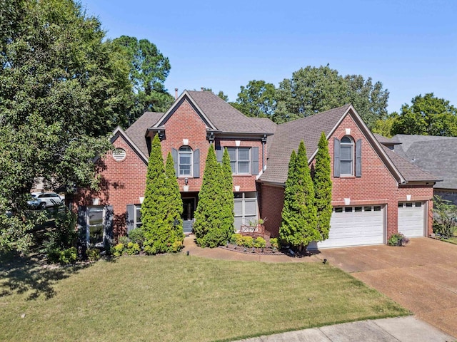 view of front facade featuring a garage and a front lawn