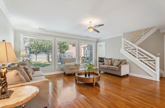 living room featuring crown molding, hardwood / wood-style flooring, and ceiling fan