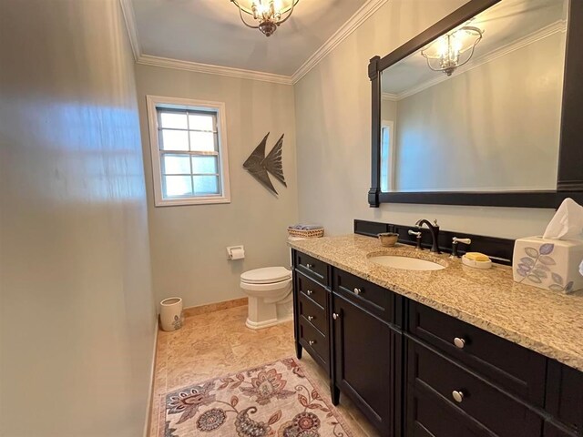 bathroom featuring vanity, toilet, crown molding, and an inviting chandelier