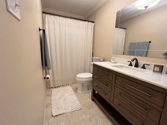 bathroom with toilet, ornamental molding, and vanity