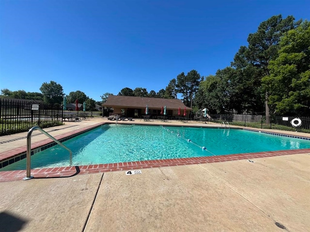 view of pool featuring a patio