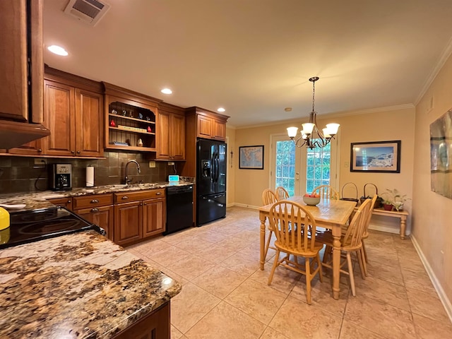 kitchen featuring tasteful backsplash, hanging light fixtures, black appliances, crown molding, and sink