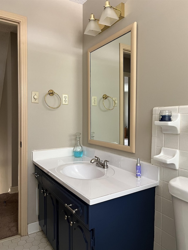 bathroom with vanity and toilet