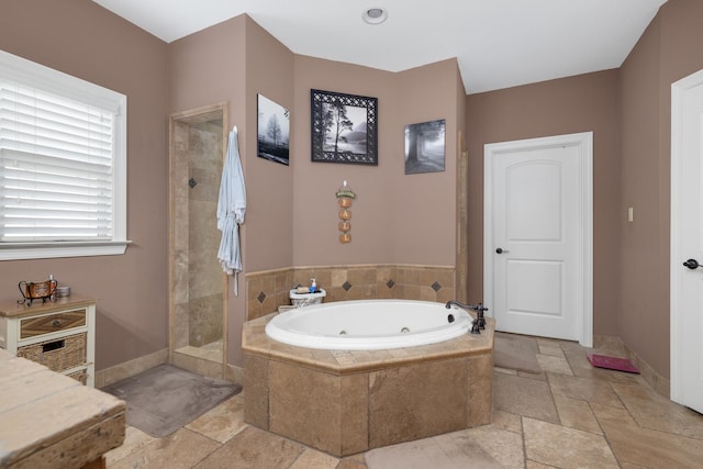 bathroom with separate shower and tub