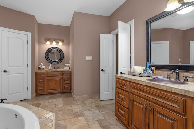 bathroom featuring a tub to relax in and vanity