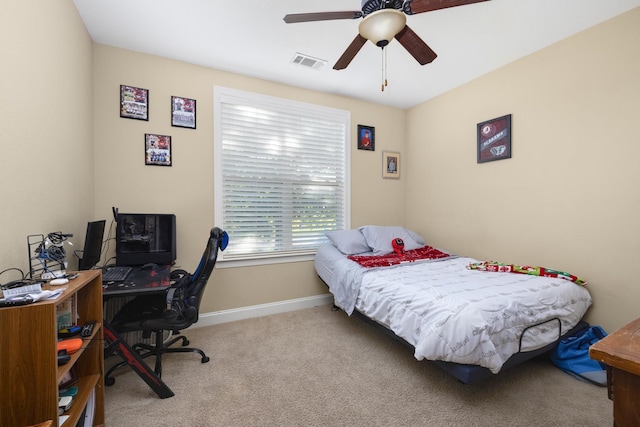 carpeted bedroom featuring ceiling fan