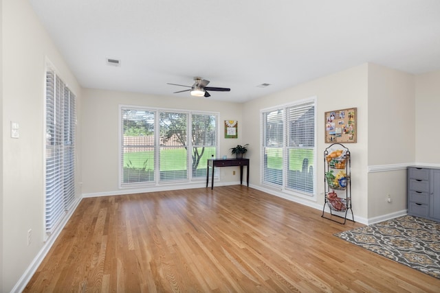 interior space with ceiling fan and light hardwood / wood-style floors