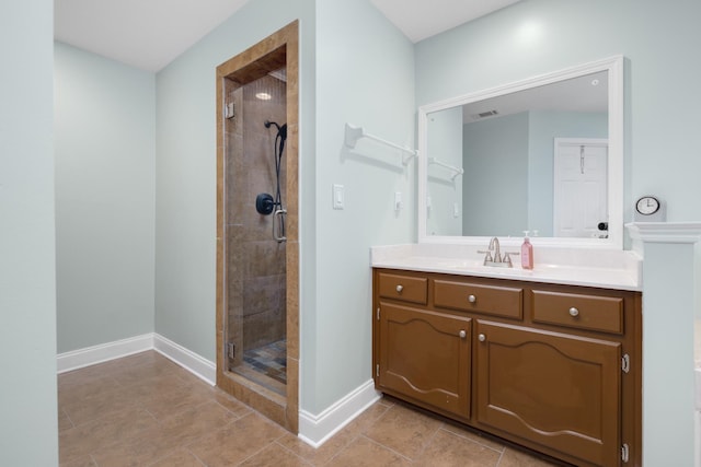 bathroom featuring vanity and a shower with door