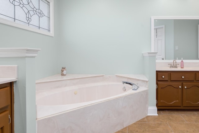 bathroom with vanity, tile patterned flooring, and a washtub