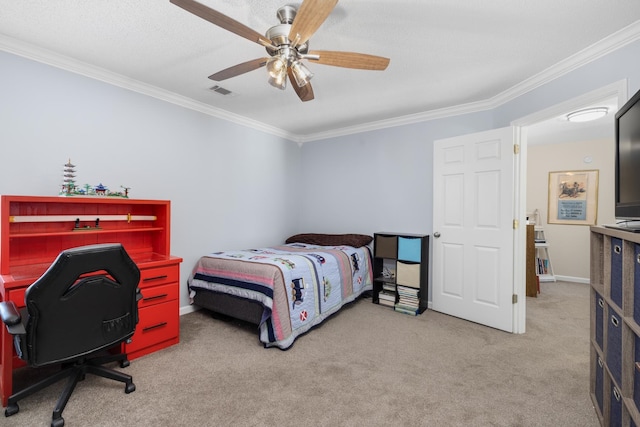 carpeted bedroom featuring ceiling fan and ornamental molding