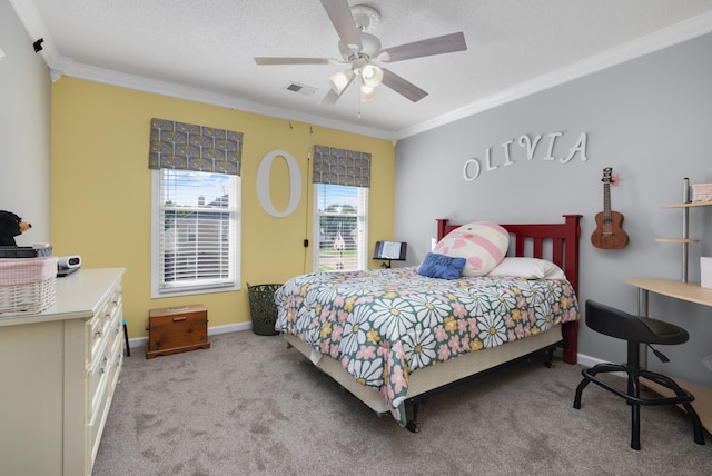 carpeted bedroom featuring ornamental molding, ceiling fan, and a textured ceiling