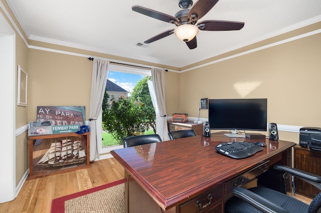 office featuring ceiling fan, ornamental molding, and light wood-type flooring