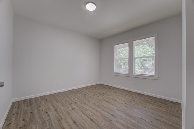 unfurnished room featuring light hardwood / wood-style floors