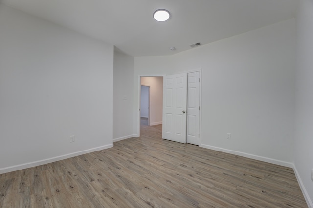 empty room with light wood-type flooring