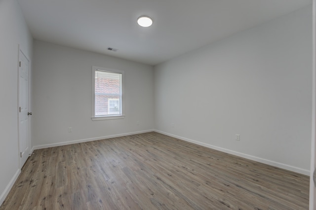 unfurnished room featuring light wood-type flooring