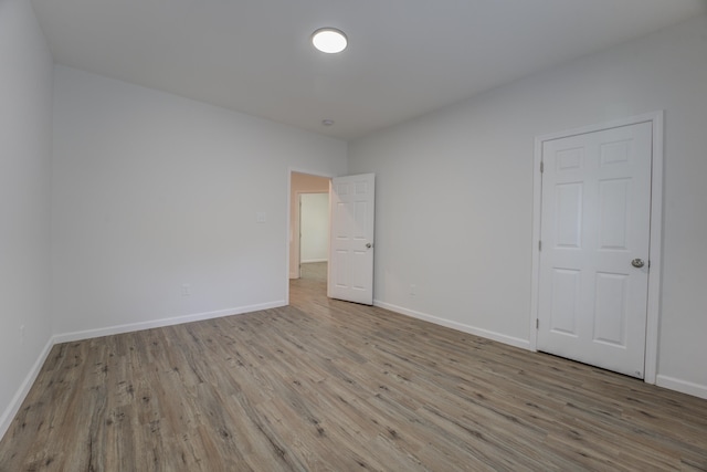 spare room with light hardwood / wood-style flooring