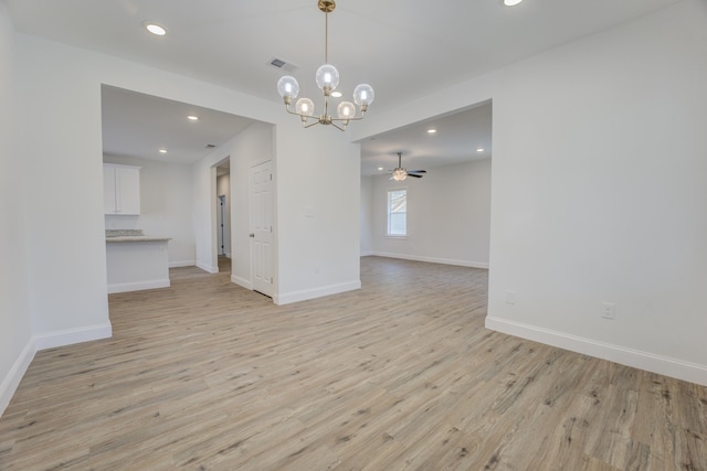 unfurnished dining area with ceiling fan and light wood-type flooring