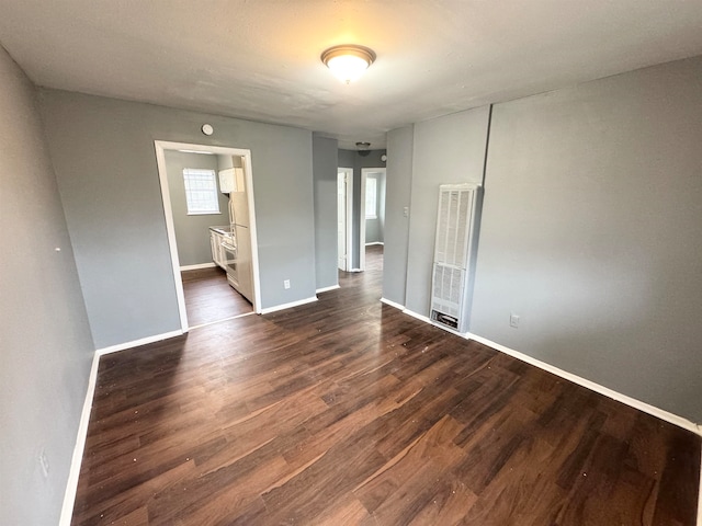 empty room with dark hardwood / wood-style floors