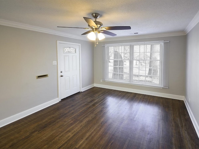 unfurnished room featuring crown molding, ceiling fan, dark hardwood / wood-style floors, and a textured ceiling