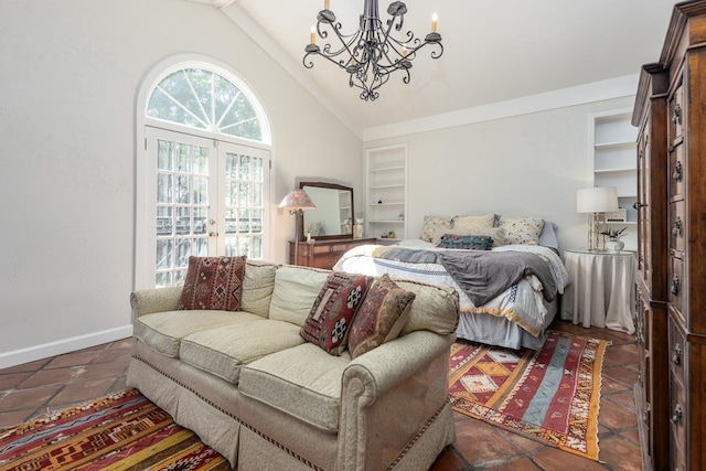 bedroom featuring dark tile patterned floors, vaulted ceiling, a notable chandelier, and french doors