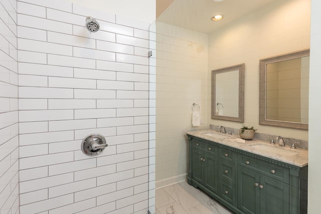 bathroom featuring vanity and tiled shower