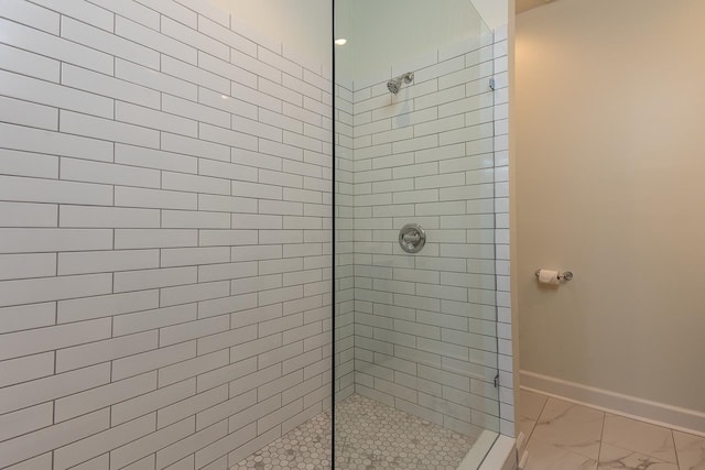 bathroom with tiled shower