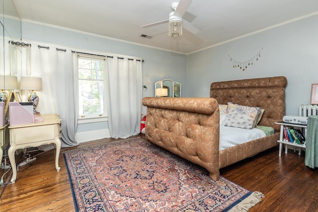 bedroom featuring crown molding, ceiling fan, and hardwood / wood-style flooring