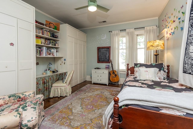 bedroom featuring ceiling fan, a closet, and ornamental molding