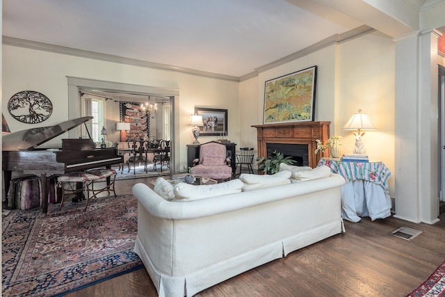 living room with dark hardwood / wood-style floors and crown molding