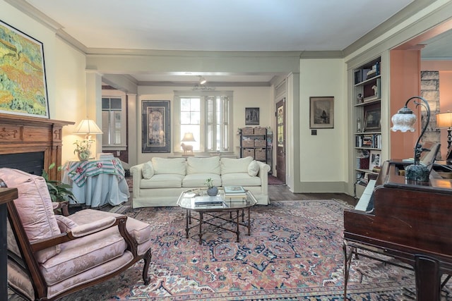 living room featuring built in features and ornamental molding