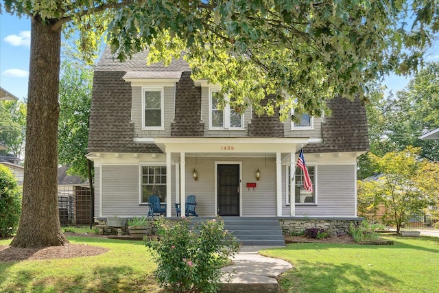 view of front of property with a front lawn and a porch