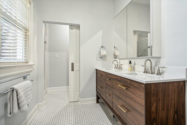 bathroom featuring walk in shower and vanity