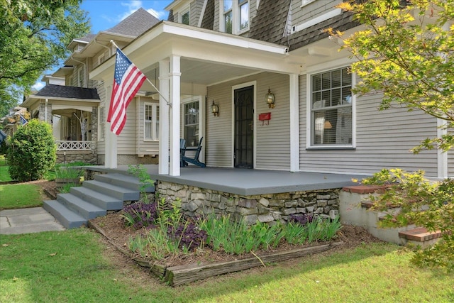 doorway to property with covered porch