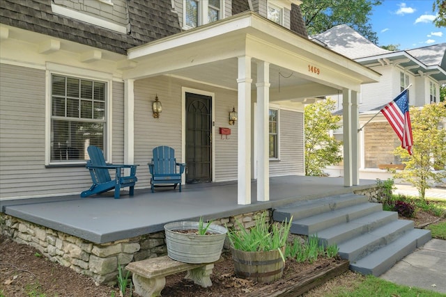 doorway to property with a porch