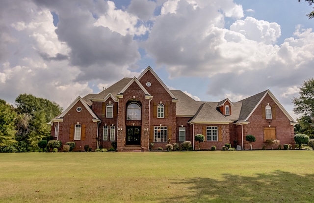 view of property featuring a front lawn