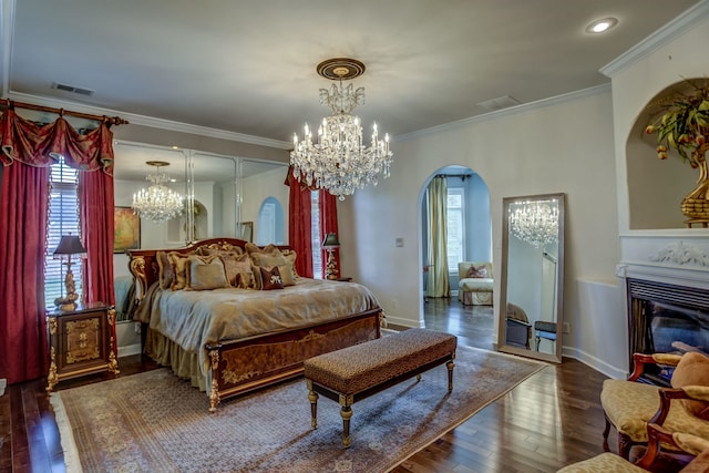 20 Windy Oaks Cv, Piperton, TN 38017 - bedroom with crown molding, arched walkways, a chandelier, and hardwood / wood-style flooring