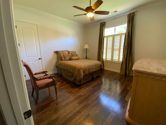 bedroom featuring crown molding, dark hardwood / wood-style flooring, and ceiling fan