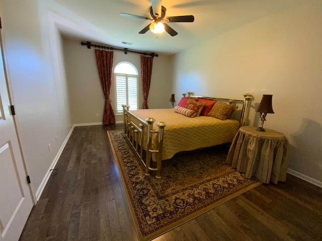 bedroom with ceiling fan and dark wood-type flooring