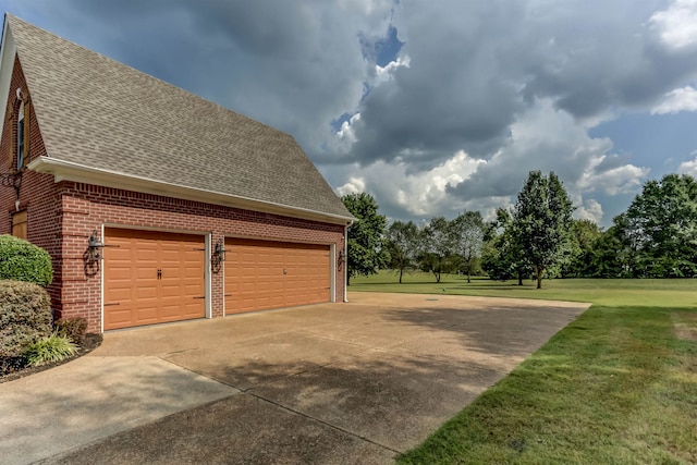 garage featuring a yard