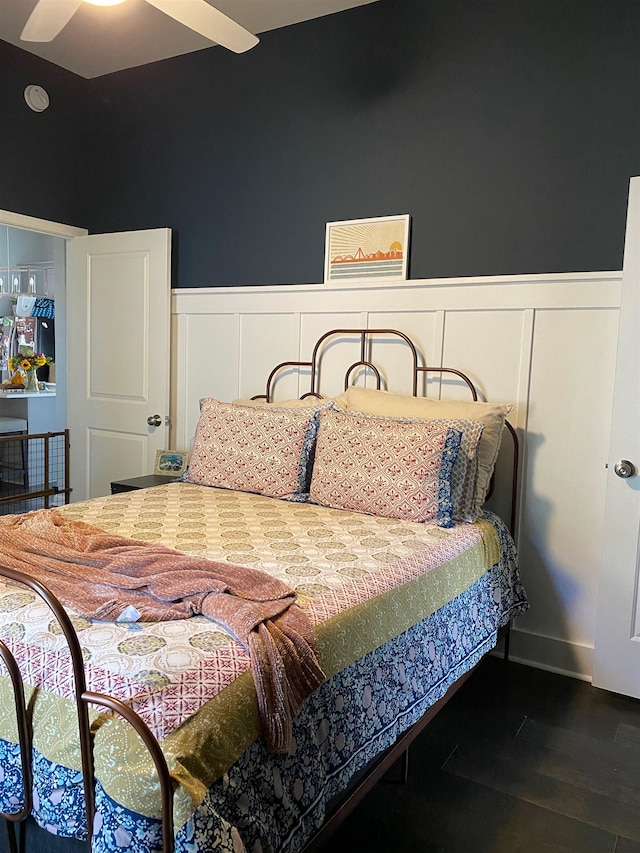 bedroom featuring wood-type flooring and ceiling fan