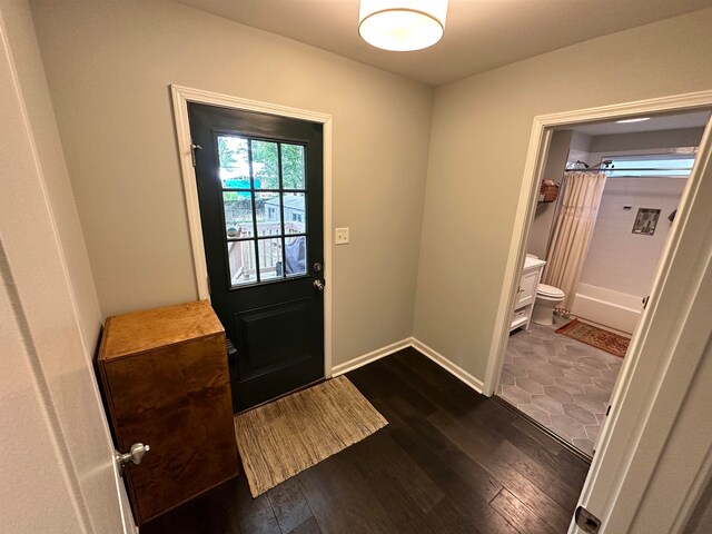 doorway featuring dark hardwood / wood-style floors