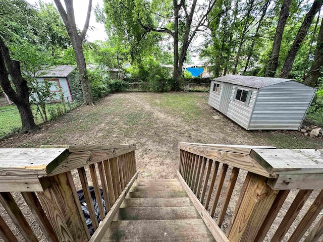 wooden terrace with a shed