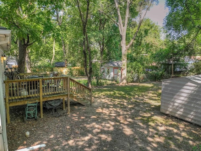 view of yard with a wooden deck