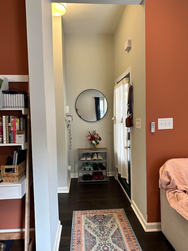 foyer entrance with dark wood-type flooring