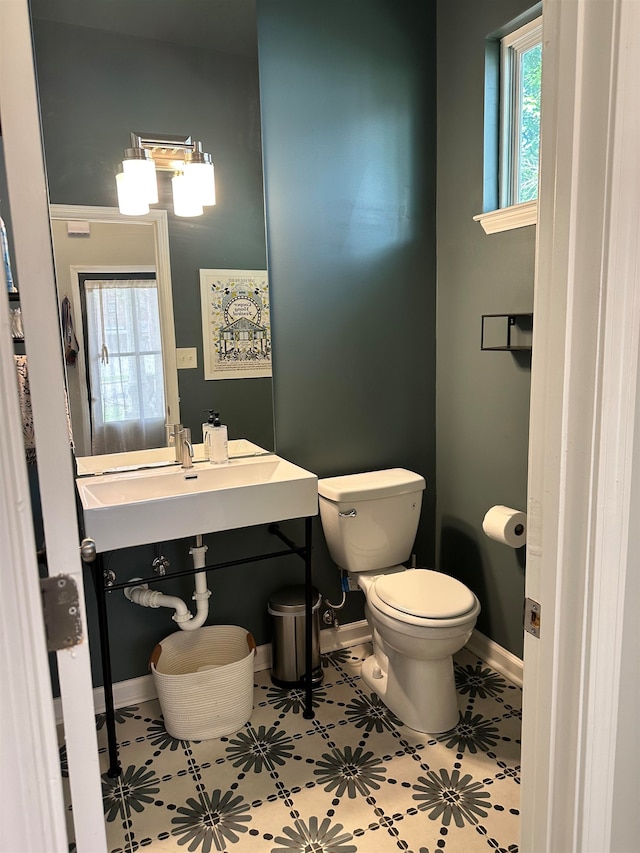 bathroom featuring tile patterned flooring and toilet