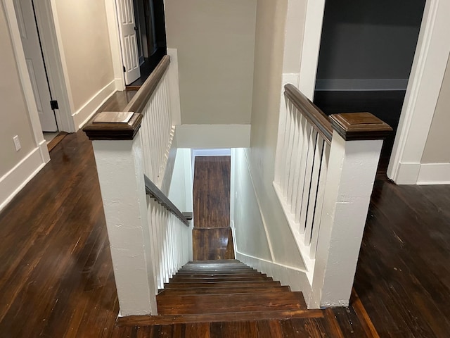 staircase featuring hardwood / wood-style floors